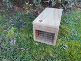 Wooden housing for DOC150 trap for rat, stoat, and hedgehog control.