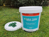 Double Tap pellet bait to control possums and rats - a container with some pellets sitting on the lid.